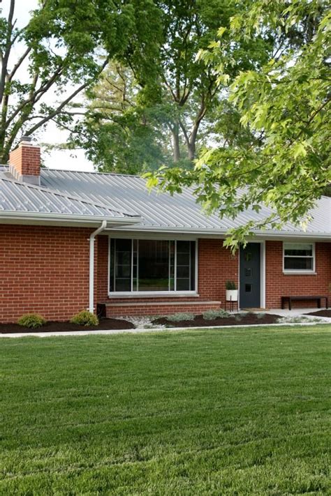 red brick brick house with metal roof|metal roof on brick ranch.